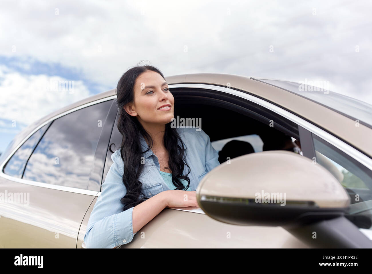 happy young woman driving in car Stock Photo - Alamy