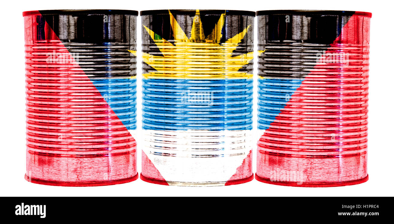 Three tin cans with the flag of Antigua and Barbuda on them isolated on a white background. Stock Photo