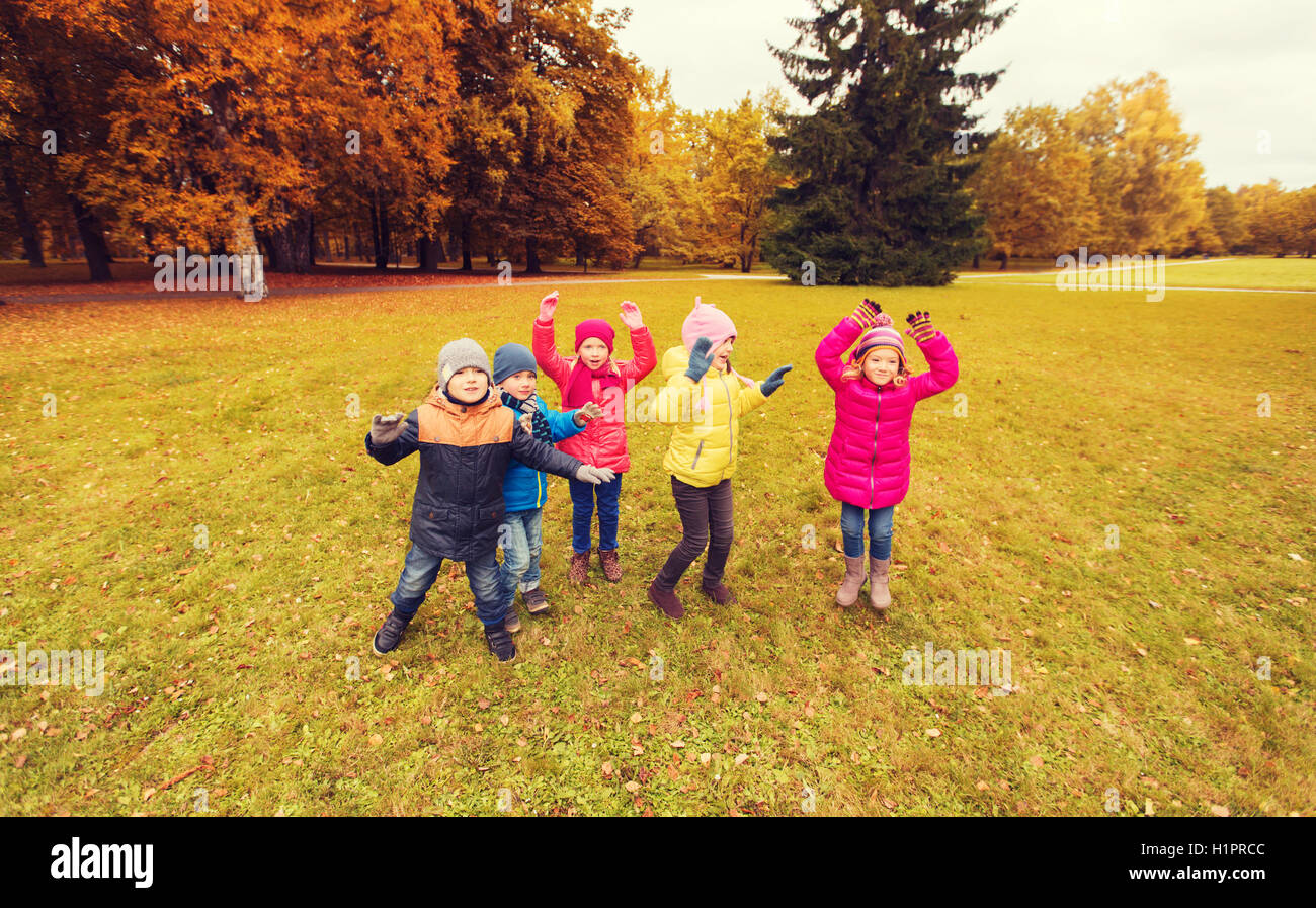 group of happy children having fun in autumn park Stock Photo - Alamy
