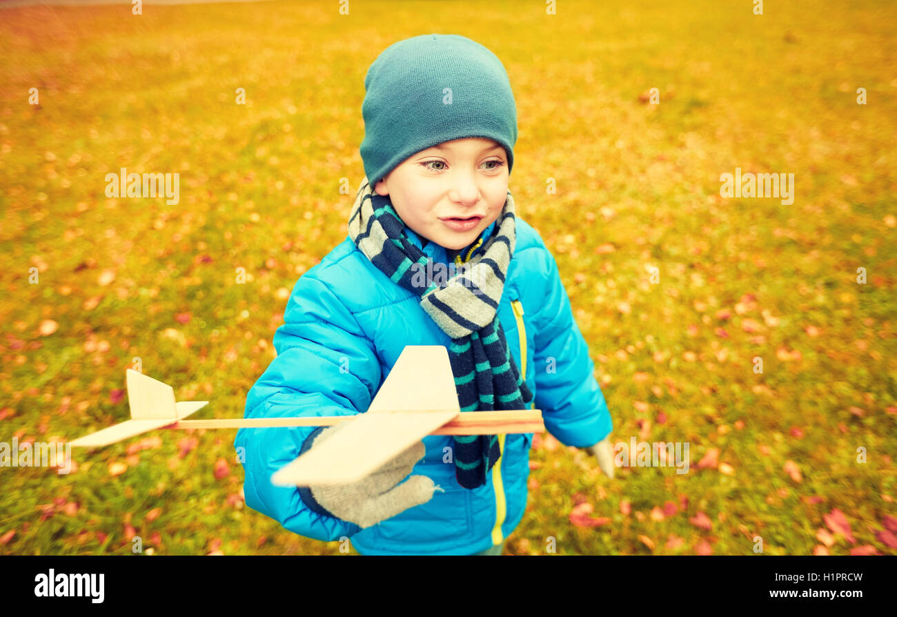 happy little boy playing with toy plane outdoors Stock Photo - Alamy
