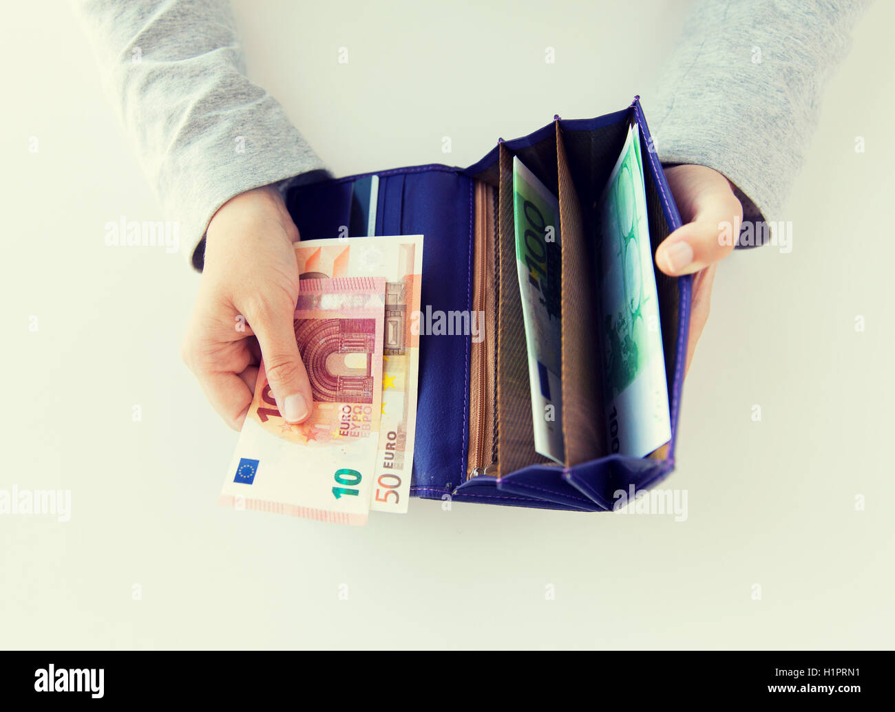 close up of woman hands with wallet and euro money Stock Photo - Alamy