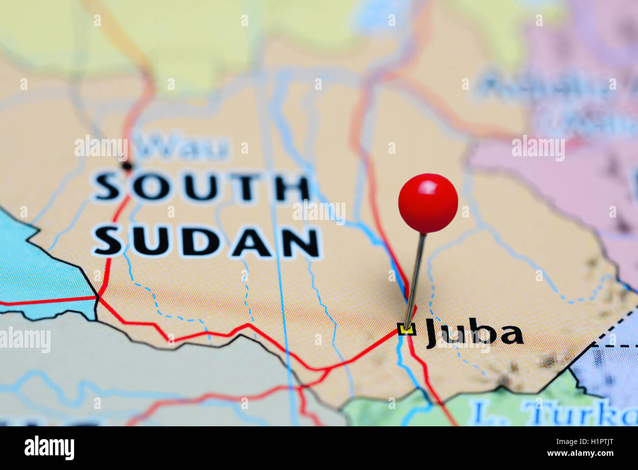 Juba pinned on a map of South Sudan Stock Photo