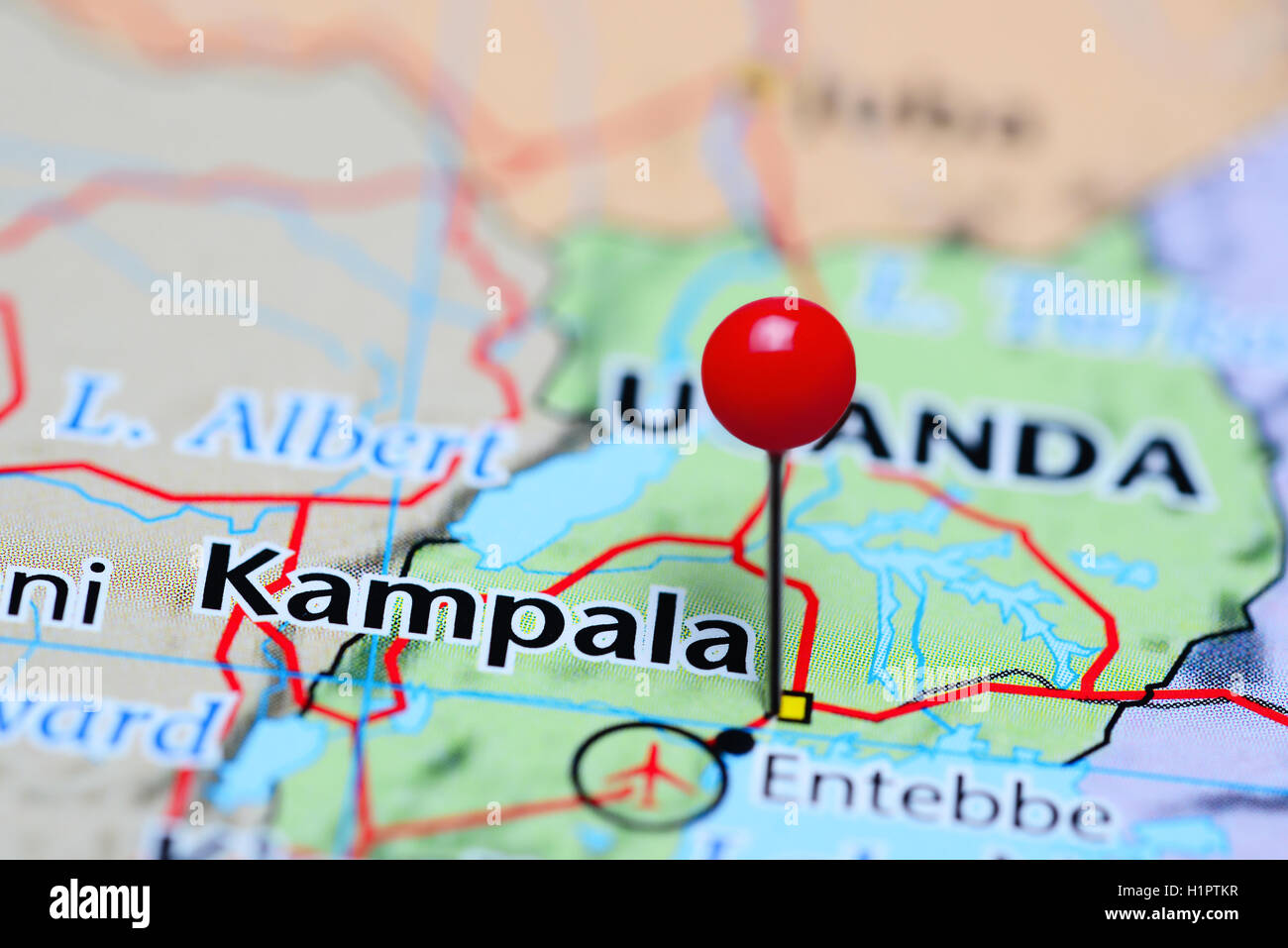 Kampala pinned on a map of Uganda Stock Photo