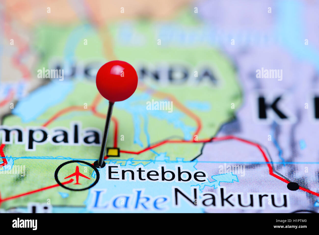 Entebbe pinned on a map of Uganda Stock Photo