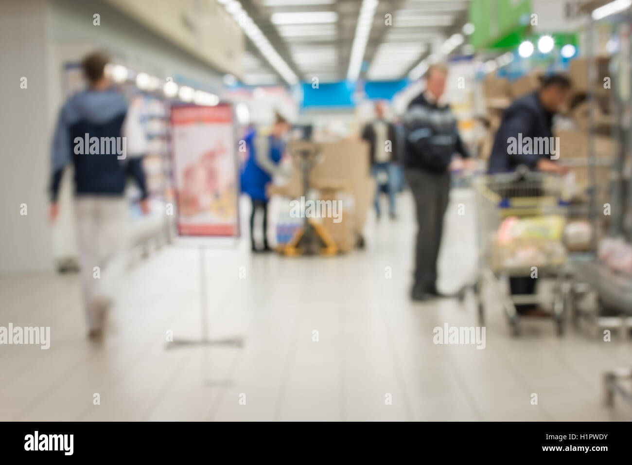 defocused background people go shopping Stock Photo