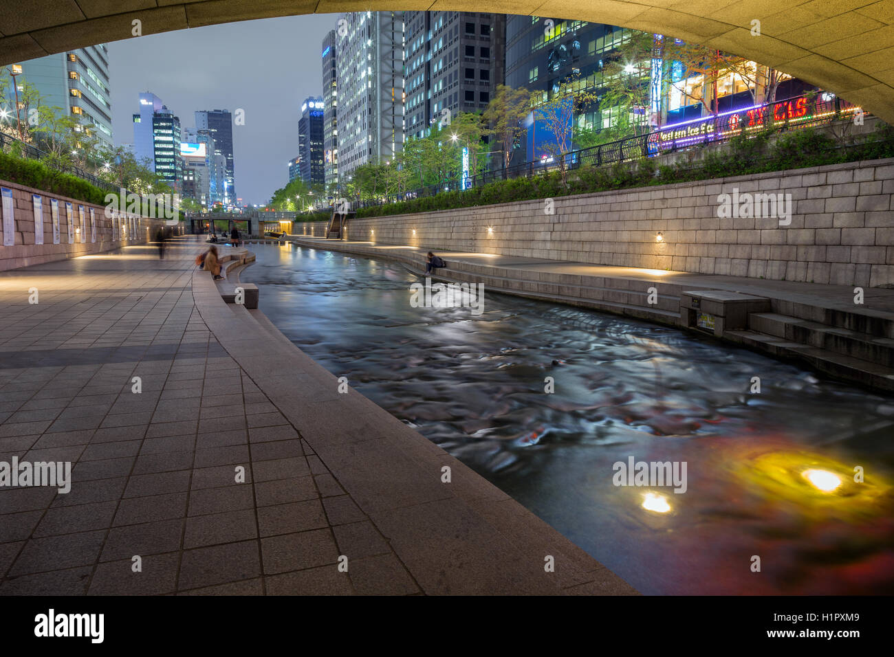 Few people along the Cheonggyecheon Stream in Seoul, South Korea in the evening. Stock Photo