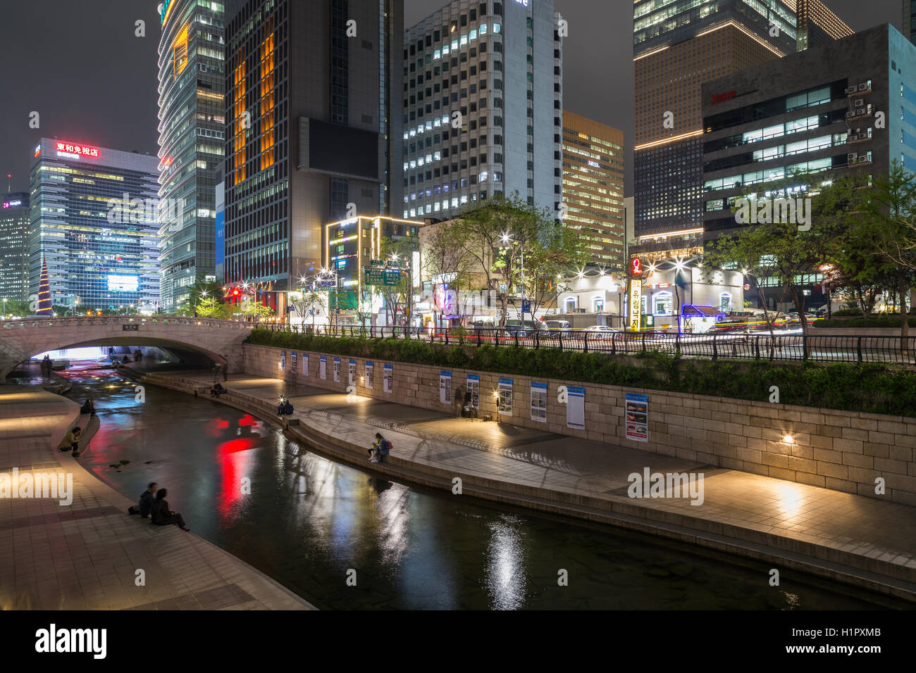 View of Cheonggyecheon Stream and buildings in the downtown of Seoul, South Korea in the evening. Stock Photo