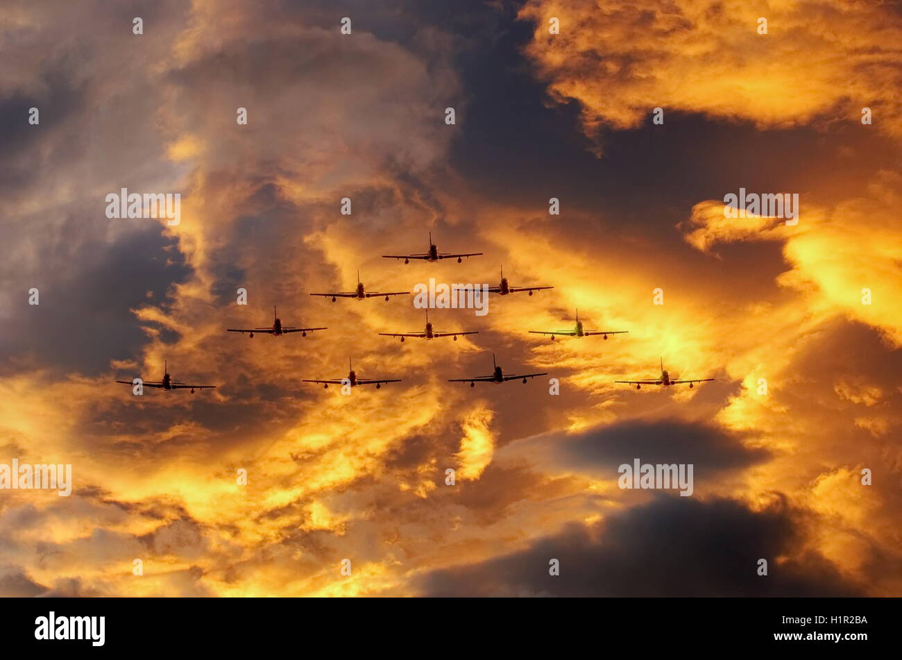 airplanes in formation with dramatic cloudy sky Stock Photo