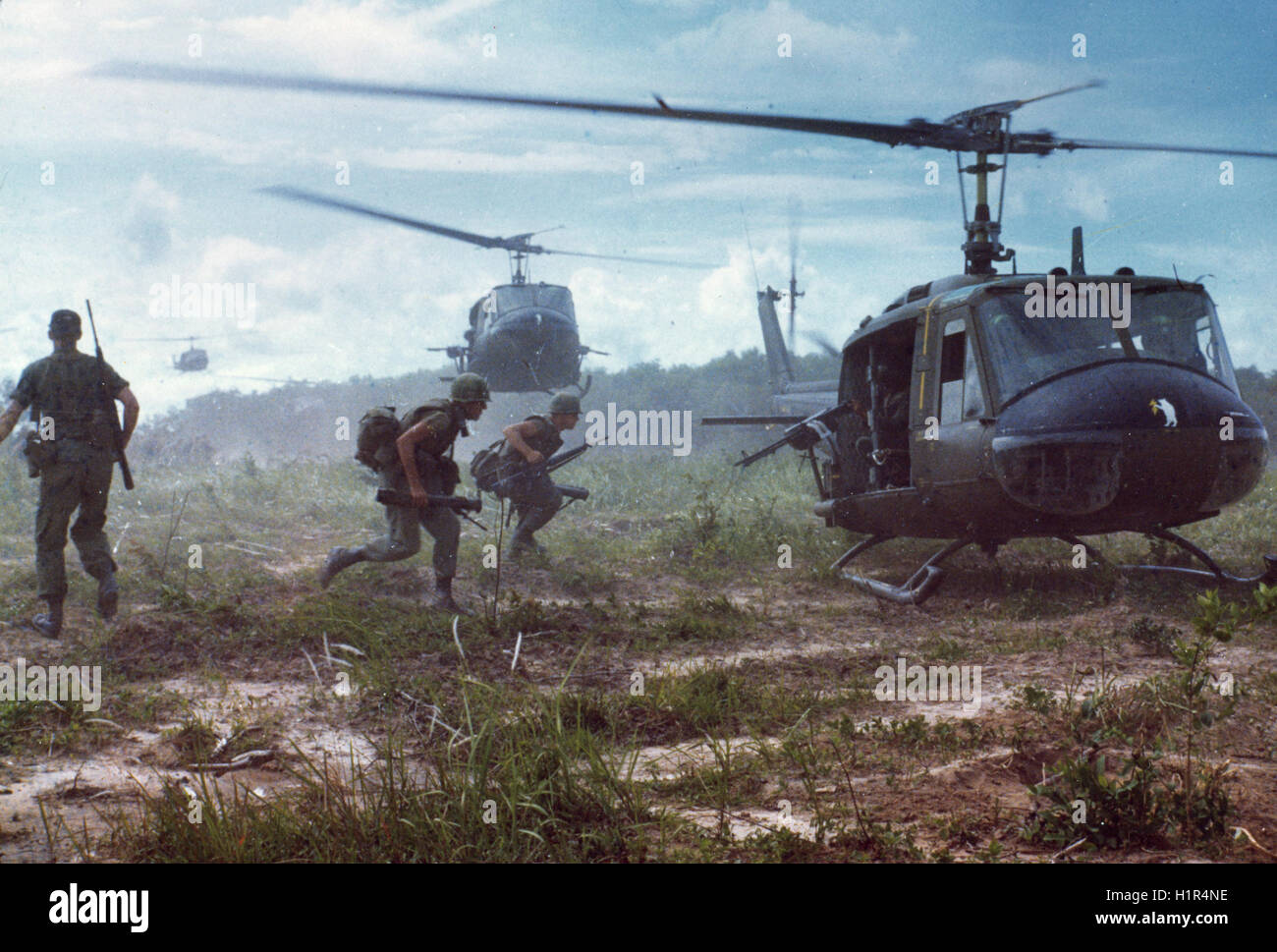 Huey helicopters airlift members of the 2nd Battalion, 14th Infantry Regiment from the Fihol Rubber Plantation to a new staging area during Operation Wahiawa, a search and destroy mission conducted by the 25th Infantry Division. Stock Photo