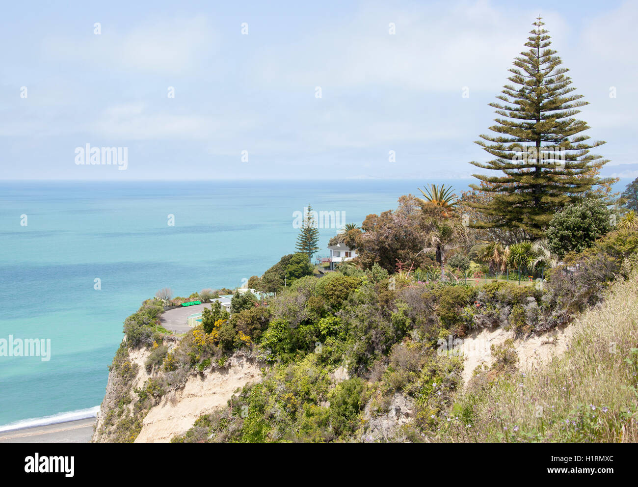 The house standing at the edge of a cliff in Napier town (New Zealand). Stock Photo