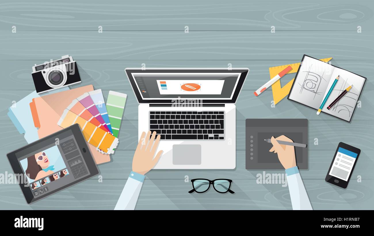 Professional creative graphic designer working at office desk, he is designing a vector illustration using a laptop Stock Vector