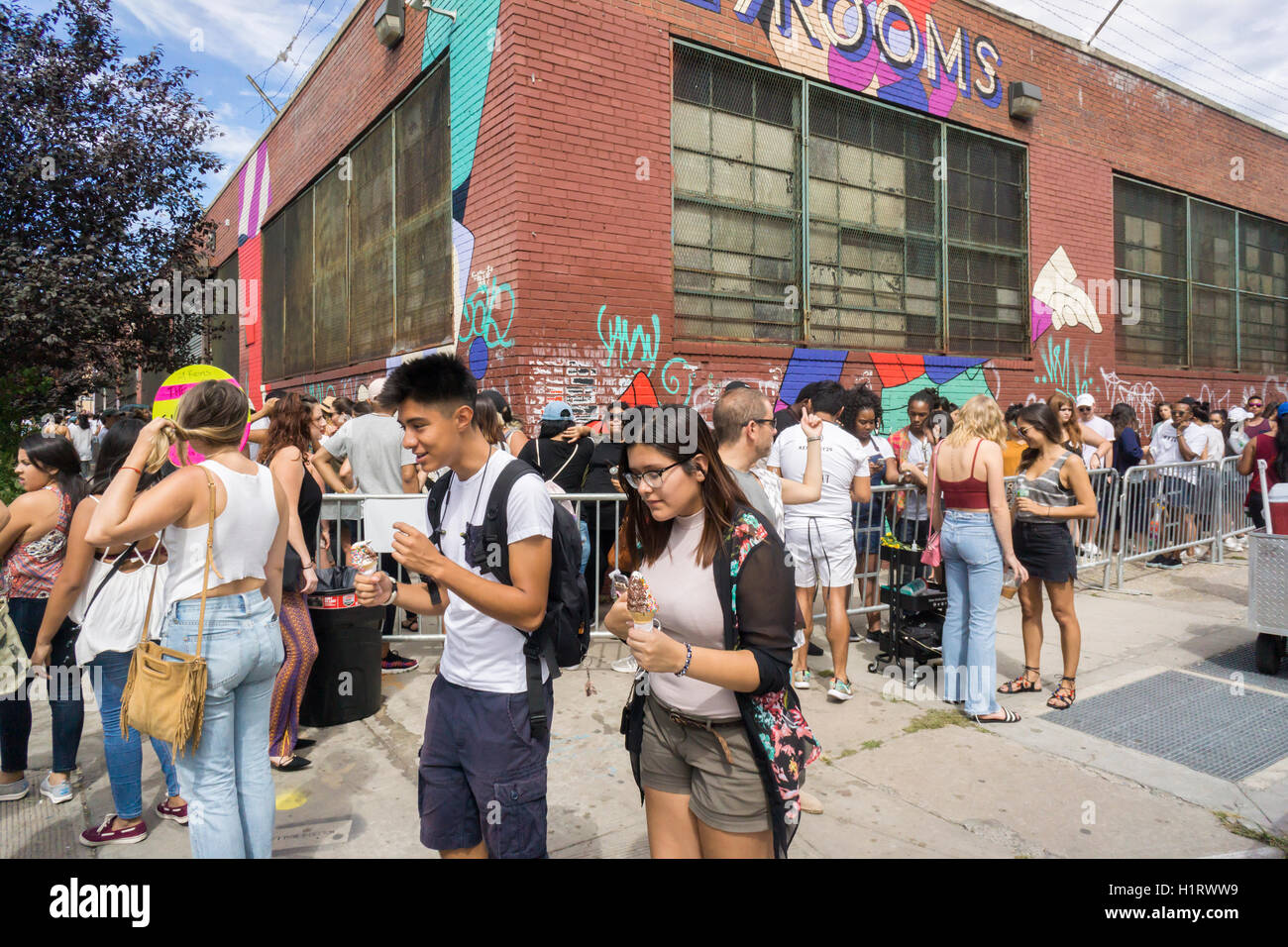 Thousands of millennials descend on the Bushwick neighborhood of Brooklyn to take in the experiential 29 Rooms installation on Sunday, September 11, 2016. The exhibit by the women's lifestyle website Refinery29 is a social media spectacle with art and culture themed rooms designed with selfies in mind. The installation was wildly popular, in part due to the social media aspect, so popular that the line was cut off at noon, hours before the last entry. (© Richard B. Levine) Stock Photo