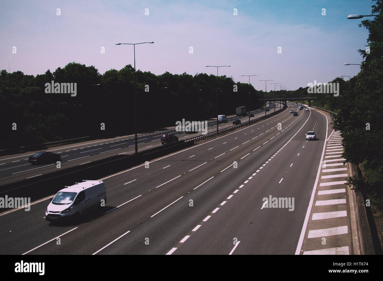 BEACONSFIELD, ENGLAND - JUNE 2016: Busy M40 motorway at the Beaconsfield turn off  Vintage Retro Filter. Stock Photo