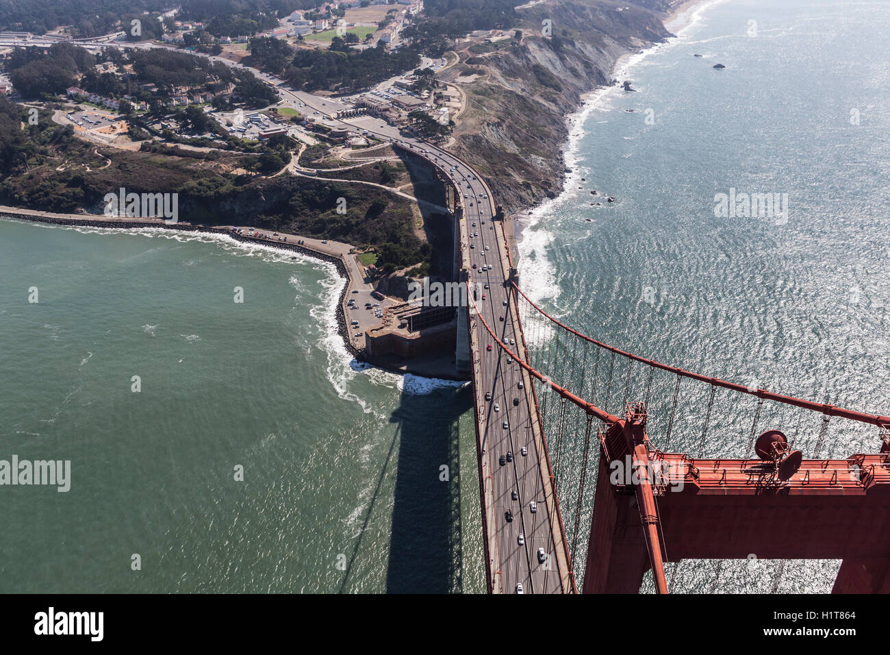 Aerial view above the Golden Gate Bridge towards Fort Point and San Francisco County. Stock Photo