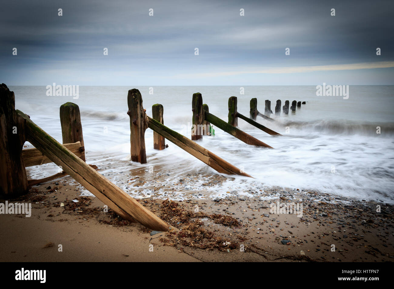 Wooden groynes on the beach with long exposure Stock Photo Alamy