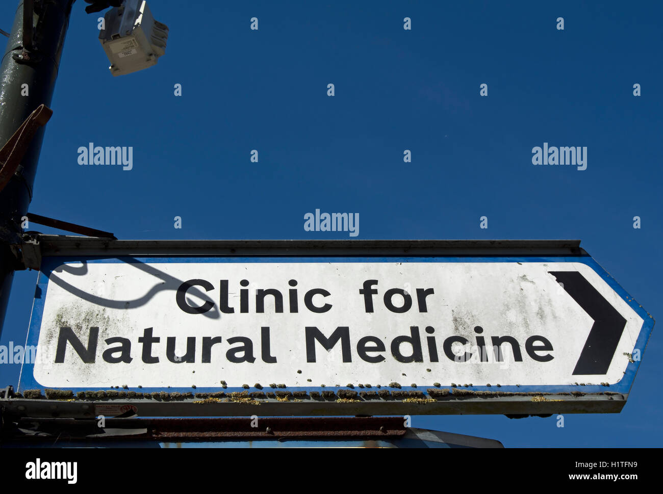 right pointing sign for the clinic for natural medicine, also known as wimbledon clinic and based in wimbledon, london, england Stock Photo