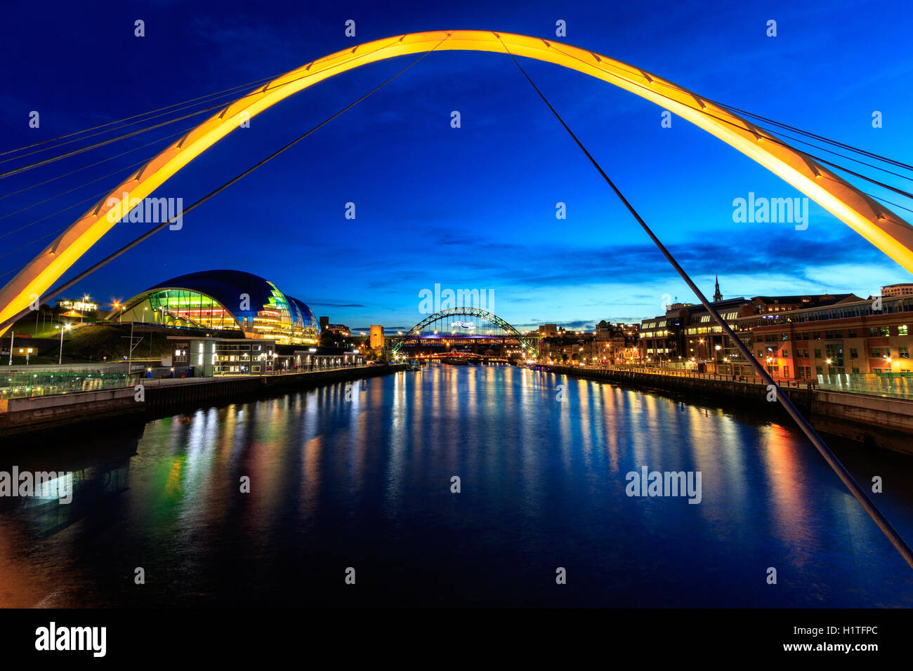 Newcastle and Gateshead at sundown showing Gateshead Millennium Bridge , sage and Tyne Bridges. Stock Photo