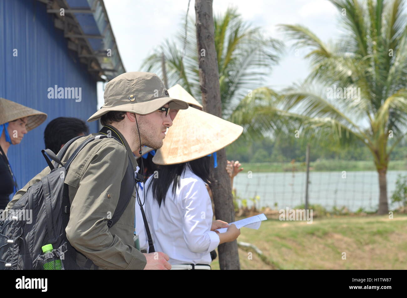 Dong Thap, Vietnam - March 1, 2013: International reporters and journalists are visiting a pangasius catfish farm in the mekong Stock Photo