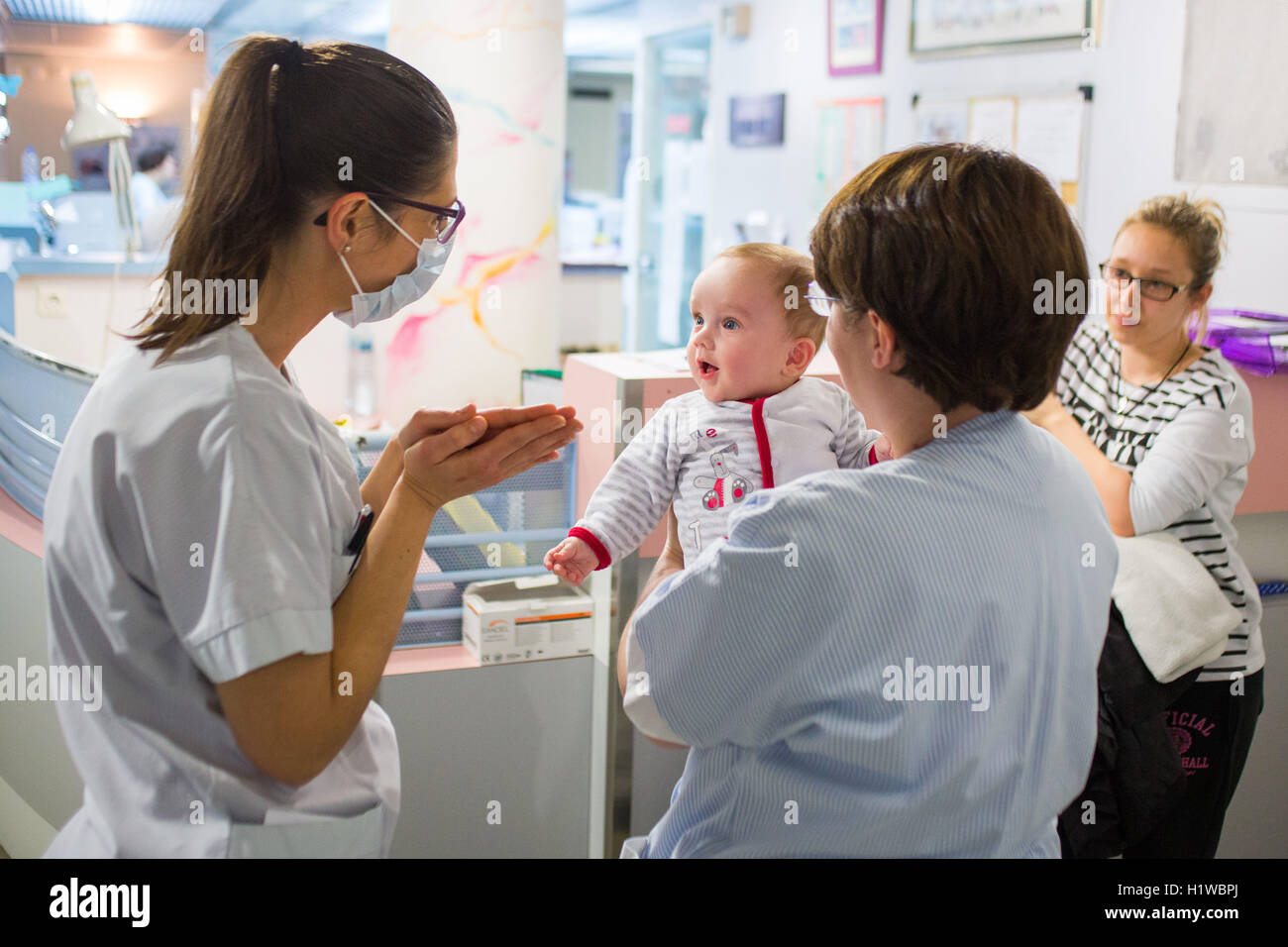 A baby who stayed in the department of neonatology several months with the care team. CHU Bordeaux, France. Stock Photo