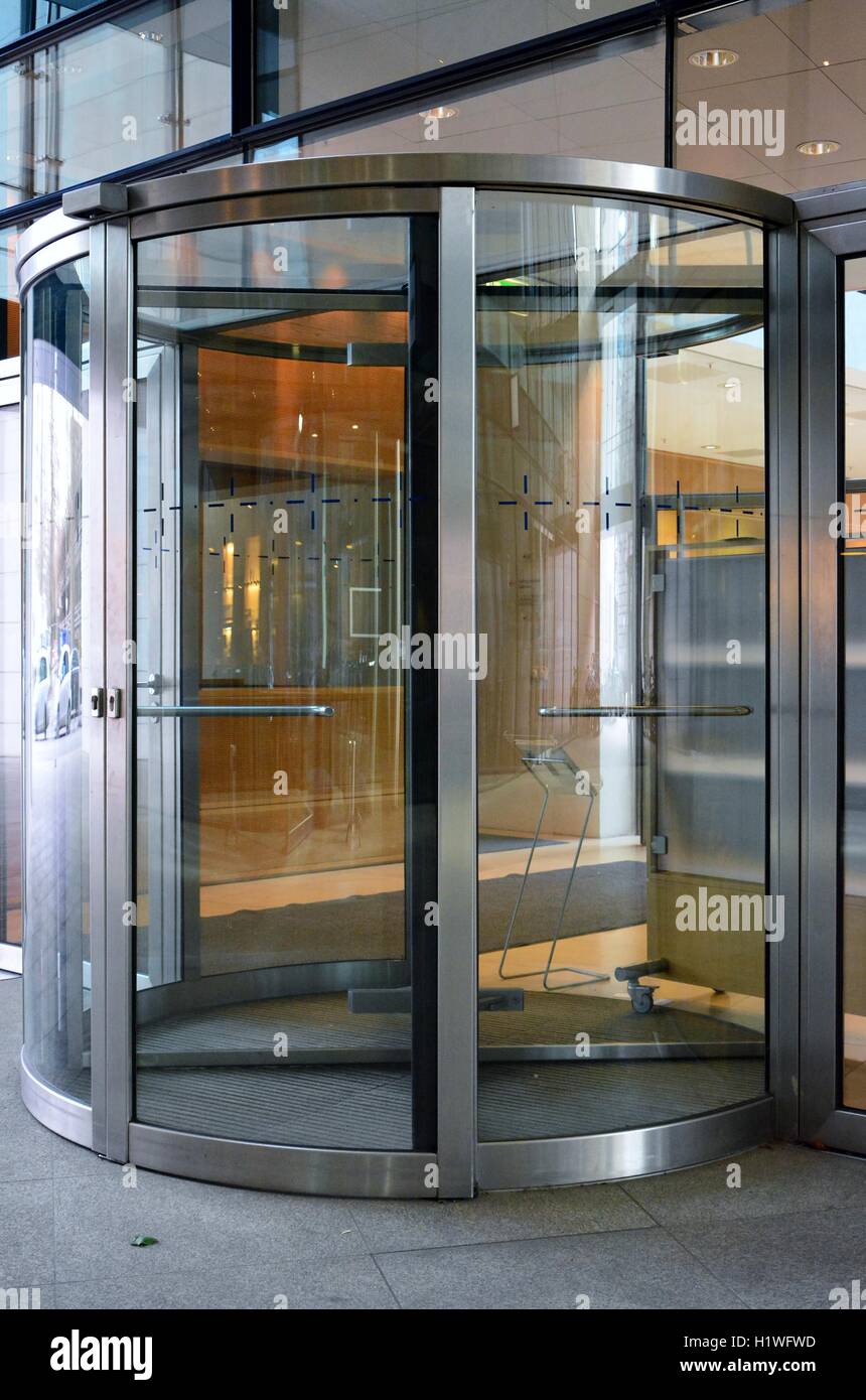 Modern revolving door as entrance to office building or hotel Stock Photo