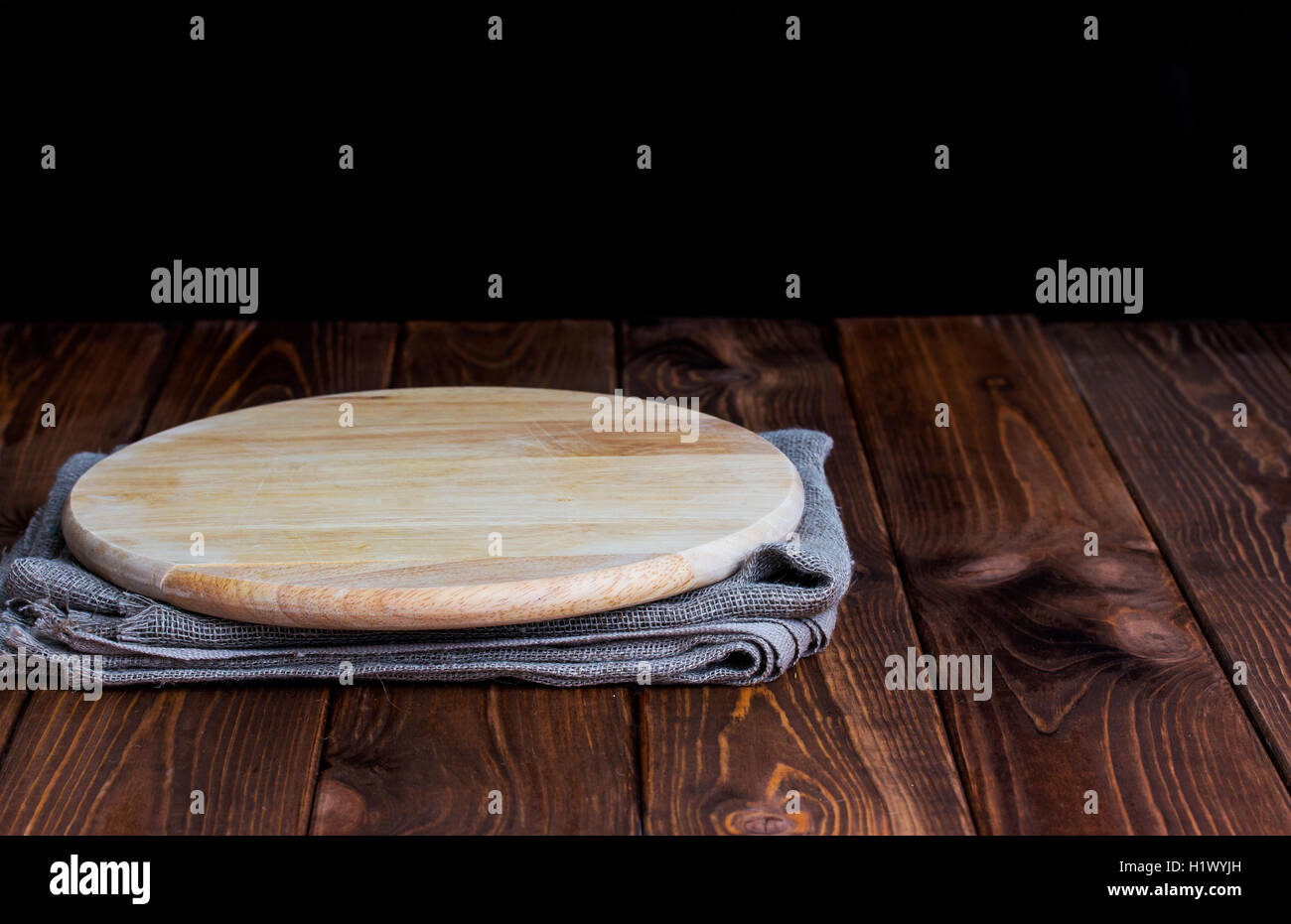 Table with round cutting board for product montage Stock Photo