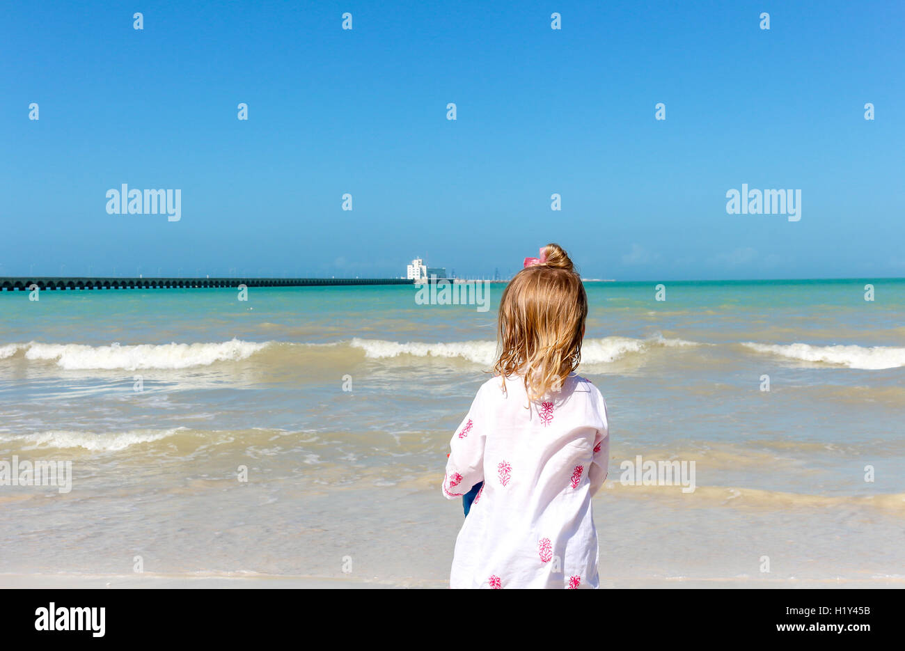 Girl staring  at the ocean Stock Photo