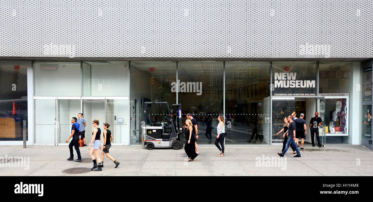 Hipsters strolling past the New Museum of Contemporary Art on the Bowery, New York, NY. Stock Photo