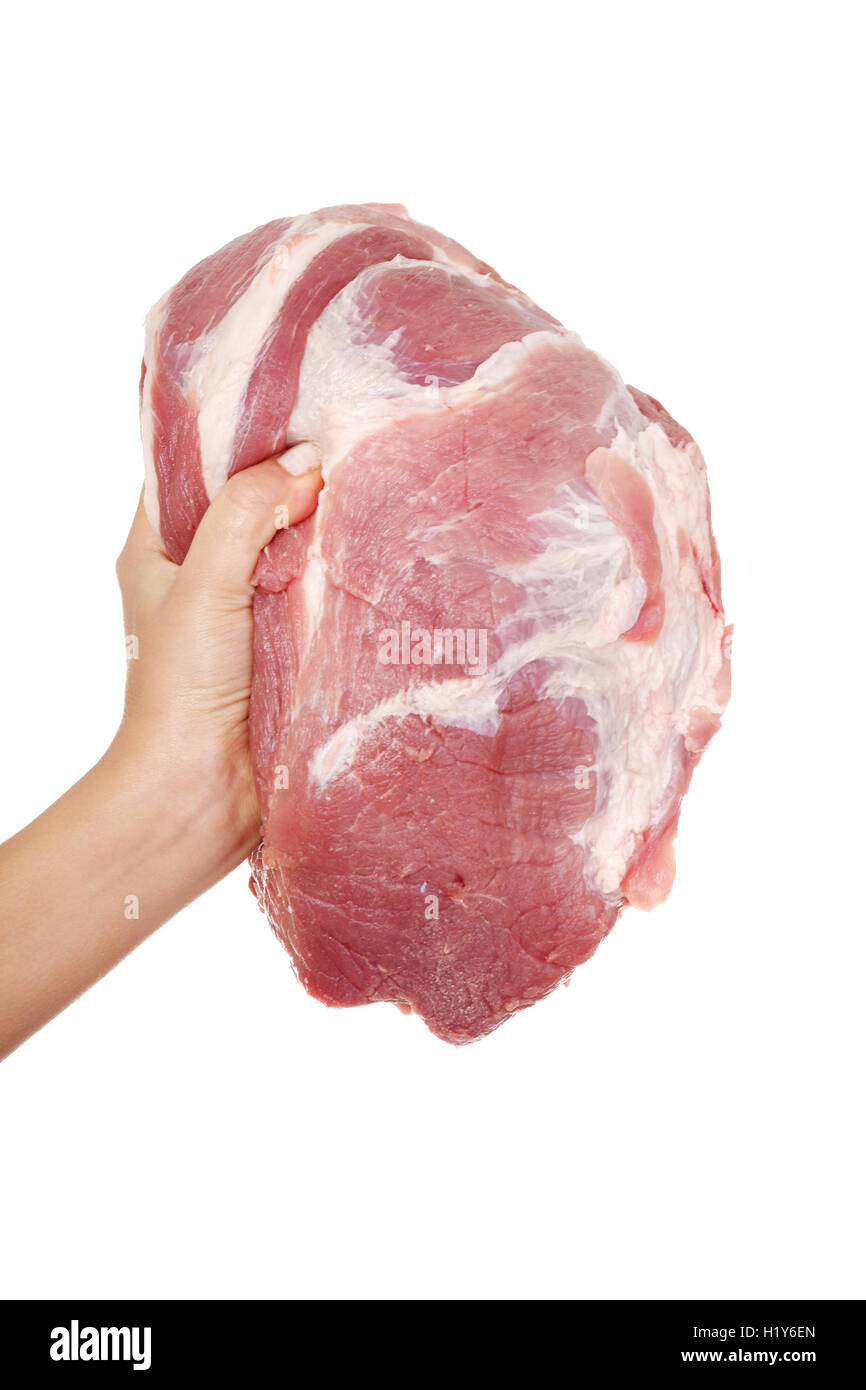 Female hand holding raw pork meat. Stock Photo