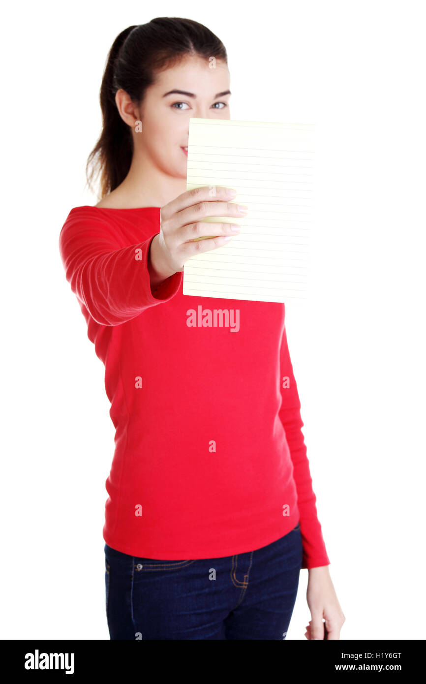 Young woman showing notepad Stock Photo - Alamy