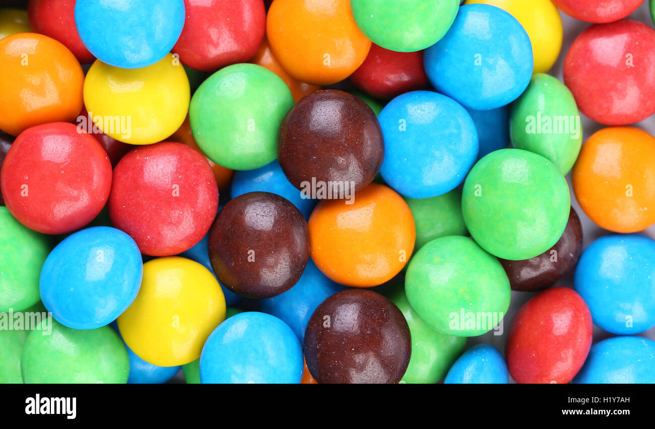 Background of chocolate balls in colorful glaze. Stock Photo