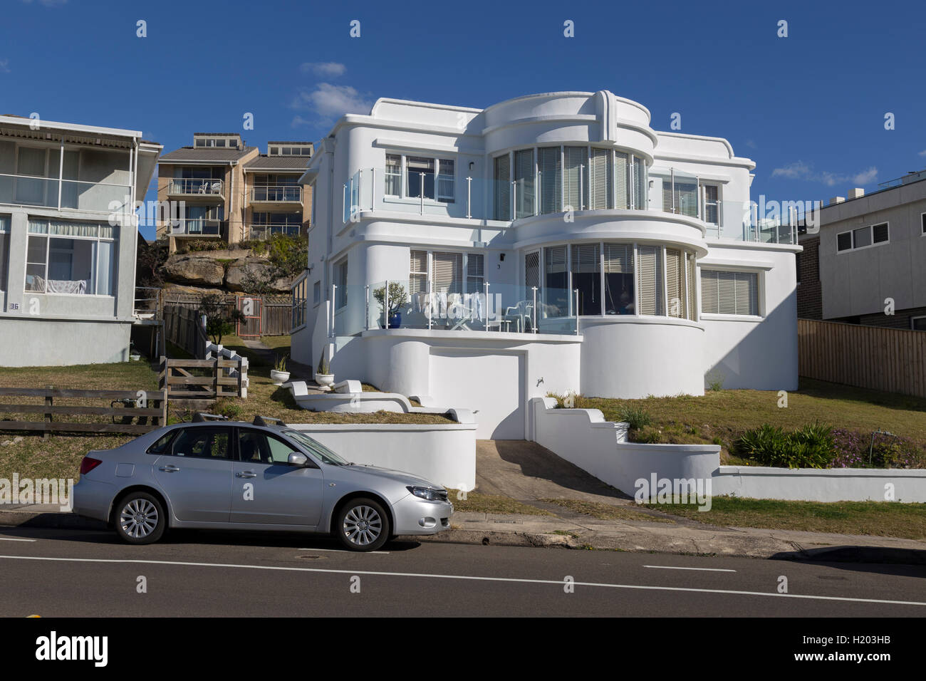 Curved white coloured house overlooking the beach at South Curl Curl on