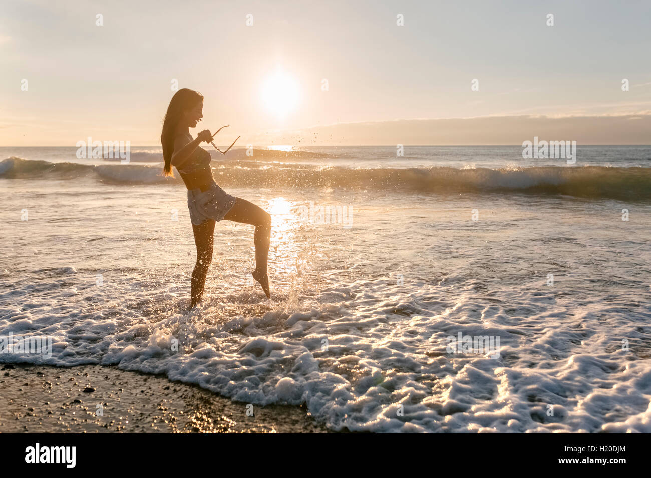 Spain, Asturias, beautiful young woman on the beach at sunset Stock ...