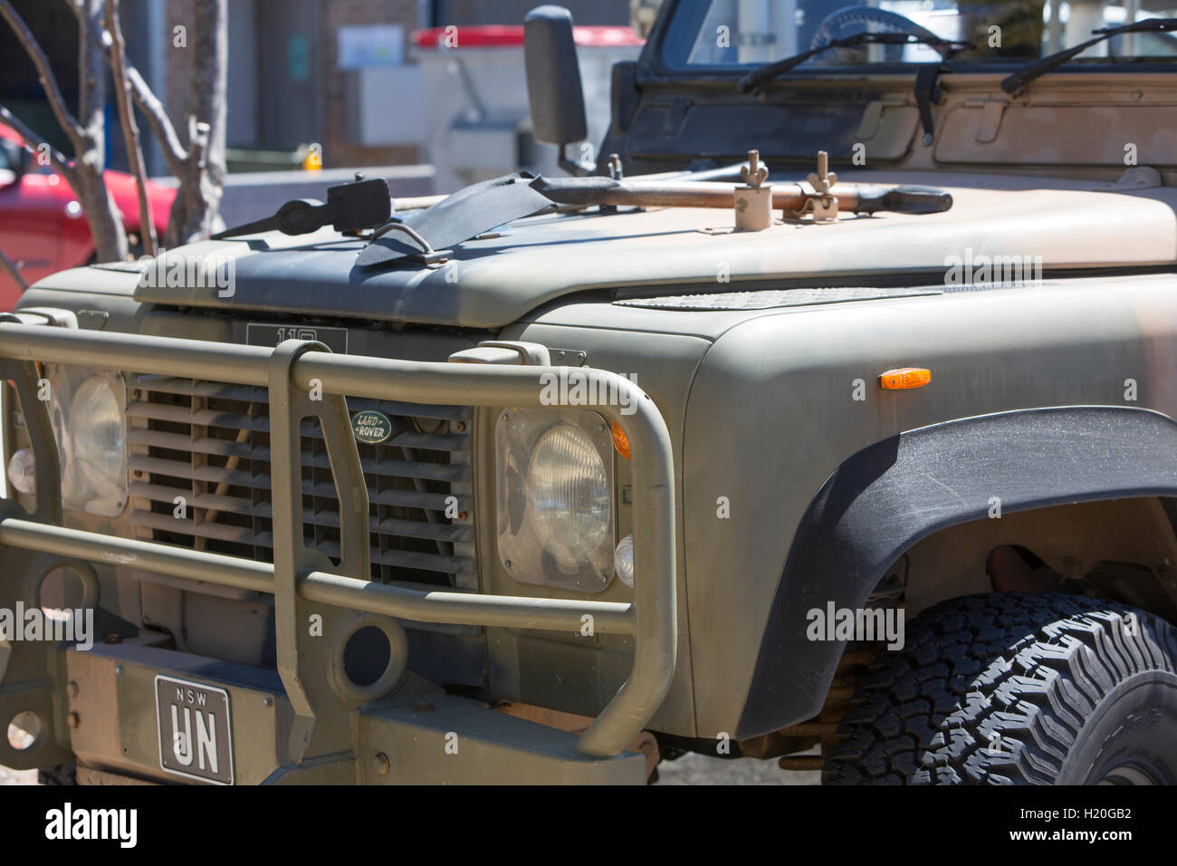Land rover defender in camouflage army colours,parked in Sydney,australia Stock Photo