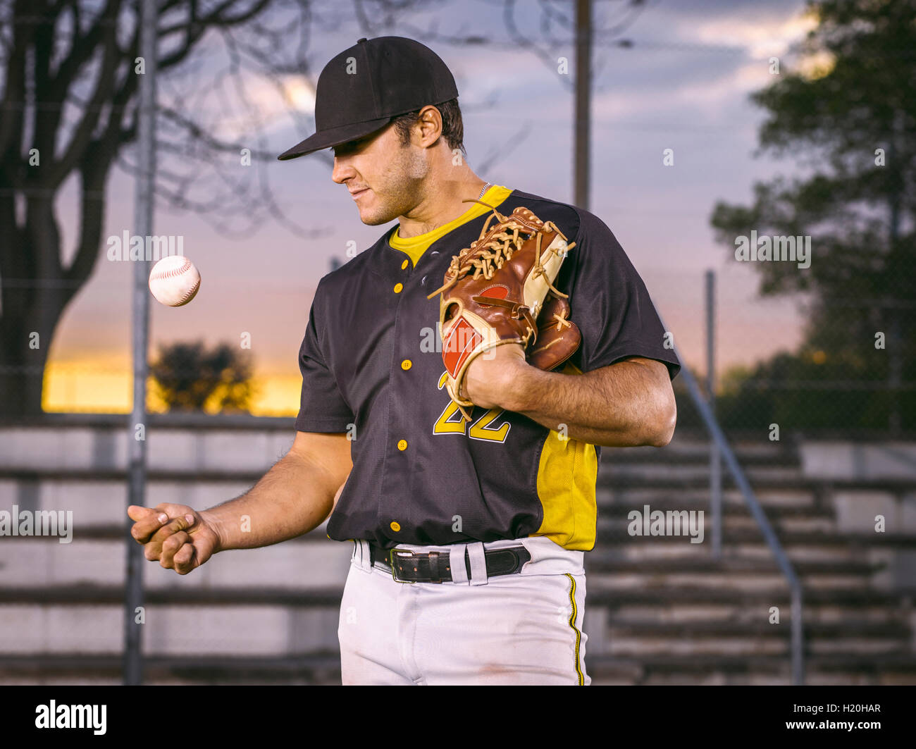 Baseball player throwing up ball Stock Photo Alamy