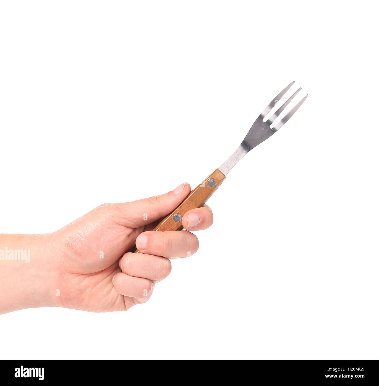 Close up of kitchen fork in hand Stock Photo Alamy