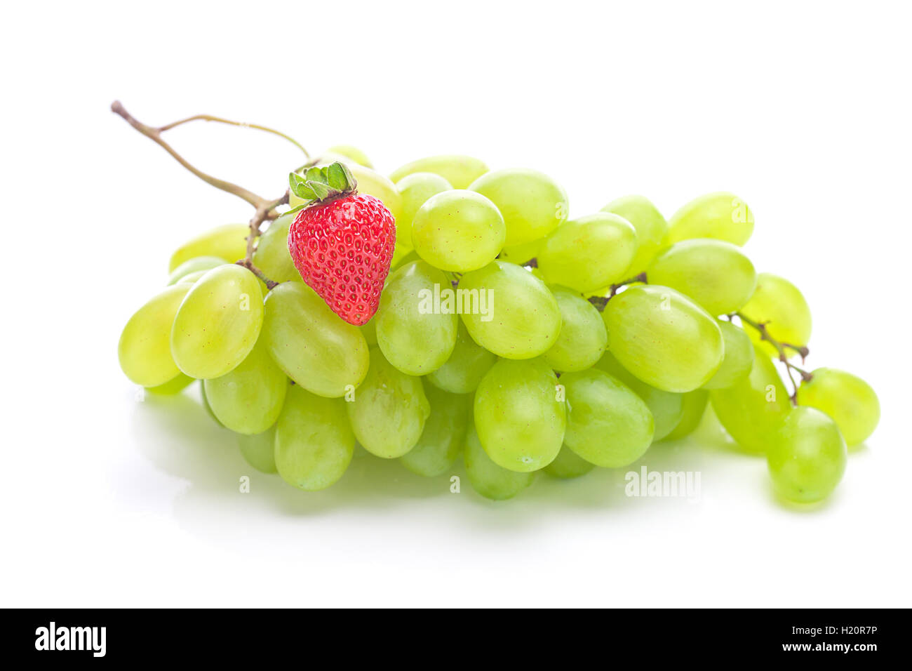 bunch of white grapes and strawberries isolated on white Stock Photo