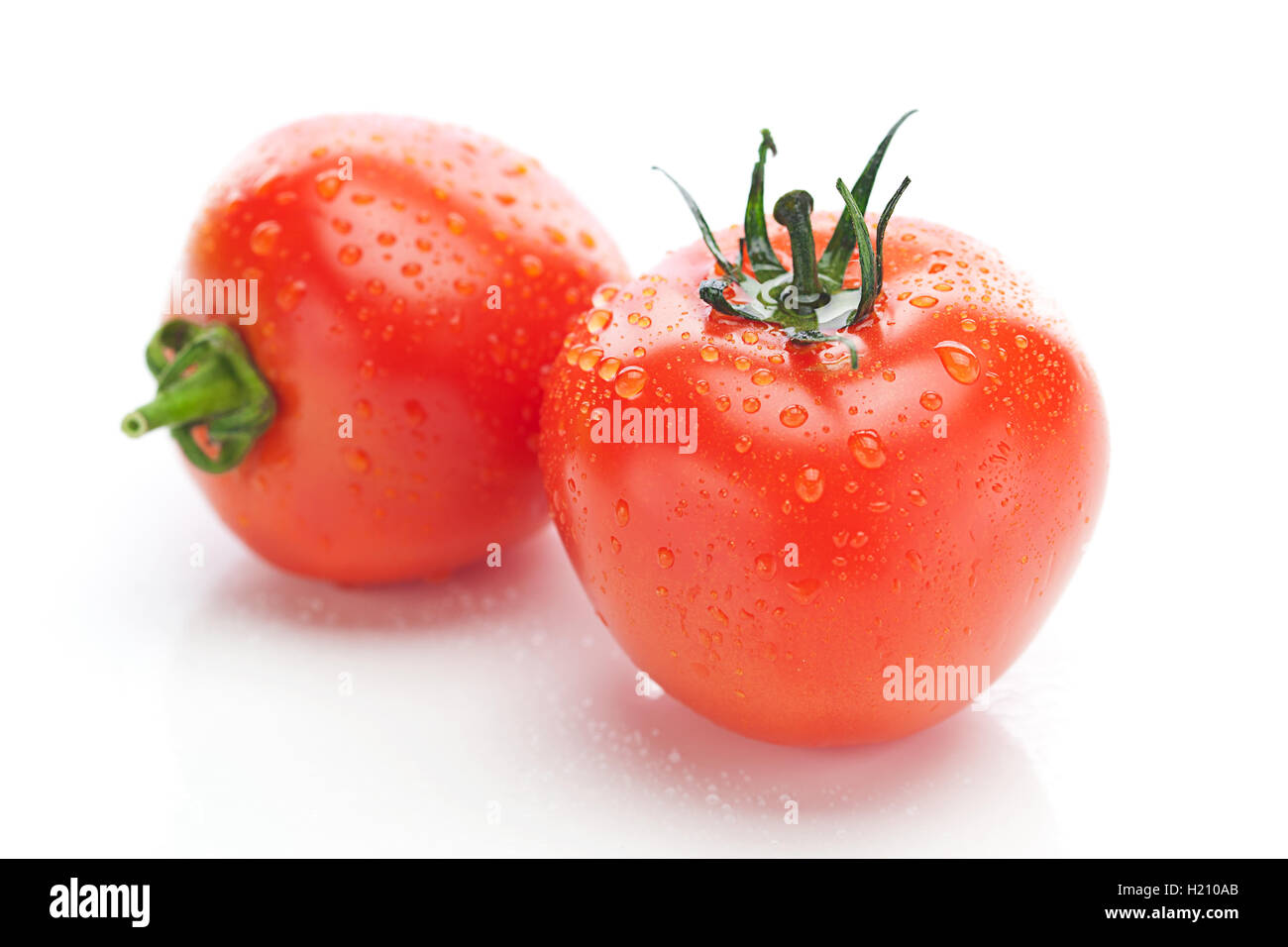 tomato with water drops isolated on white Stock Photo - Alamy