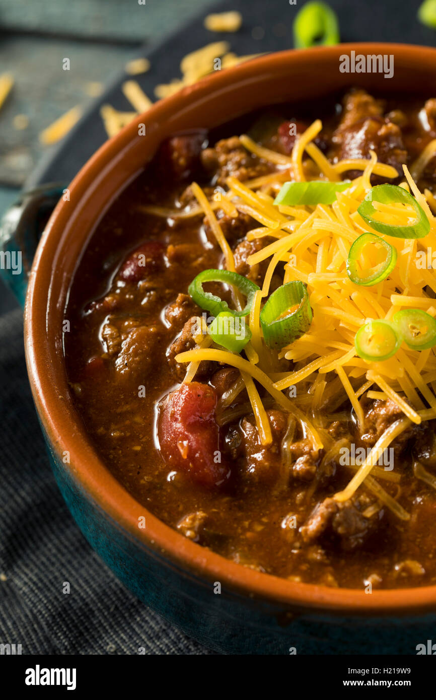 Homemade Beef Chili Con Carne with Cheese and Onions Stock Photo