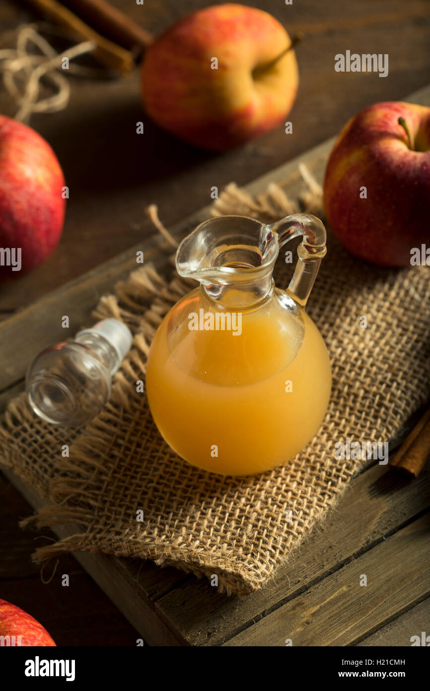 Raw Organic Apple Cider Vinegar in a Bottle Stock Photo