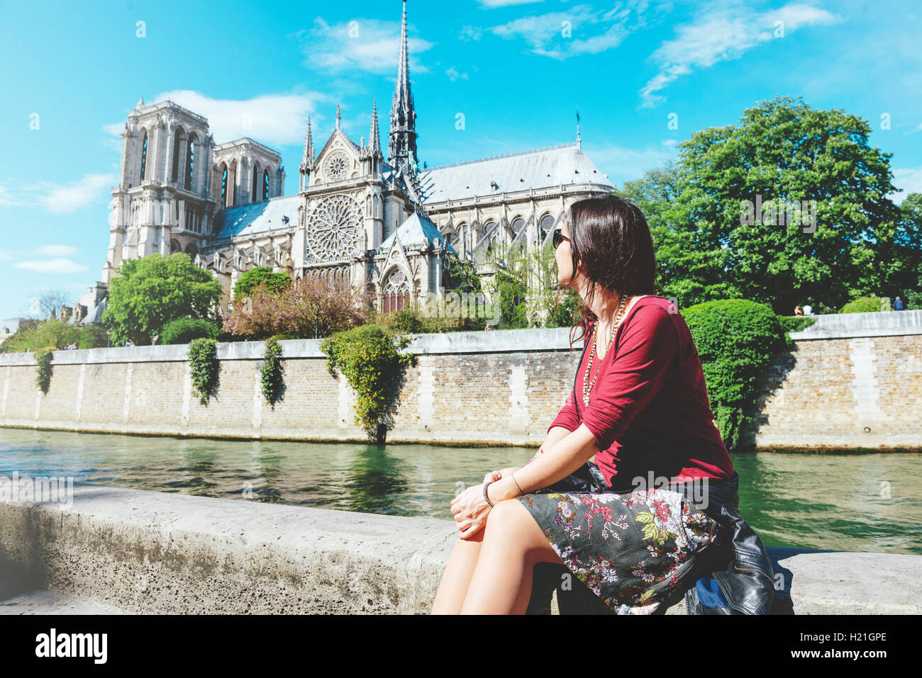 France Paris Woman Sitting On The Bank Of The Seine River In