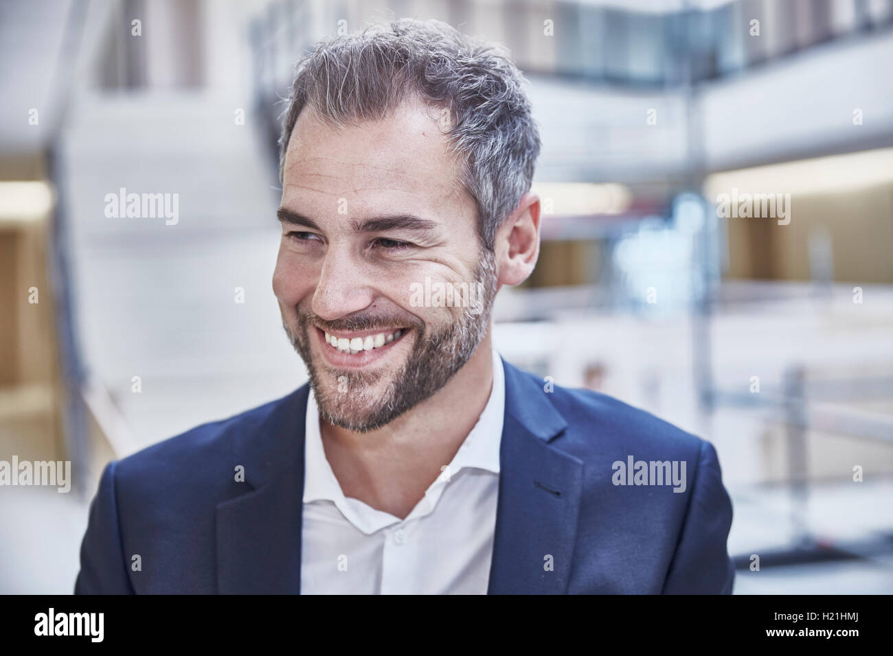 Portrait of smiling businessman Stock Photo - Alamy