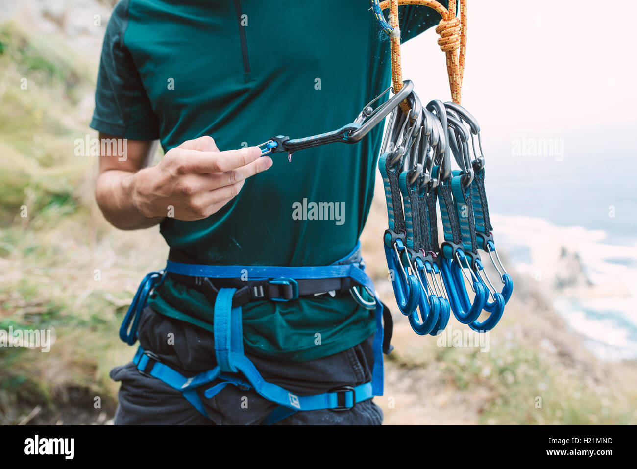 Young man preparing climbing equipment Stock Photo