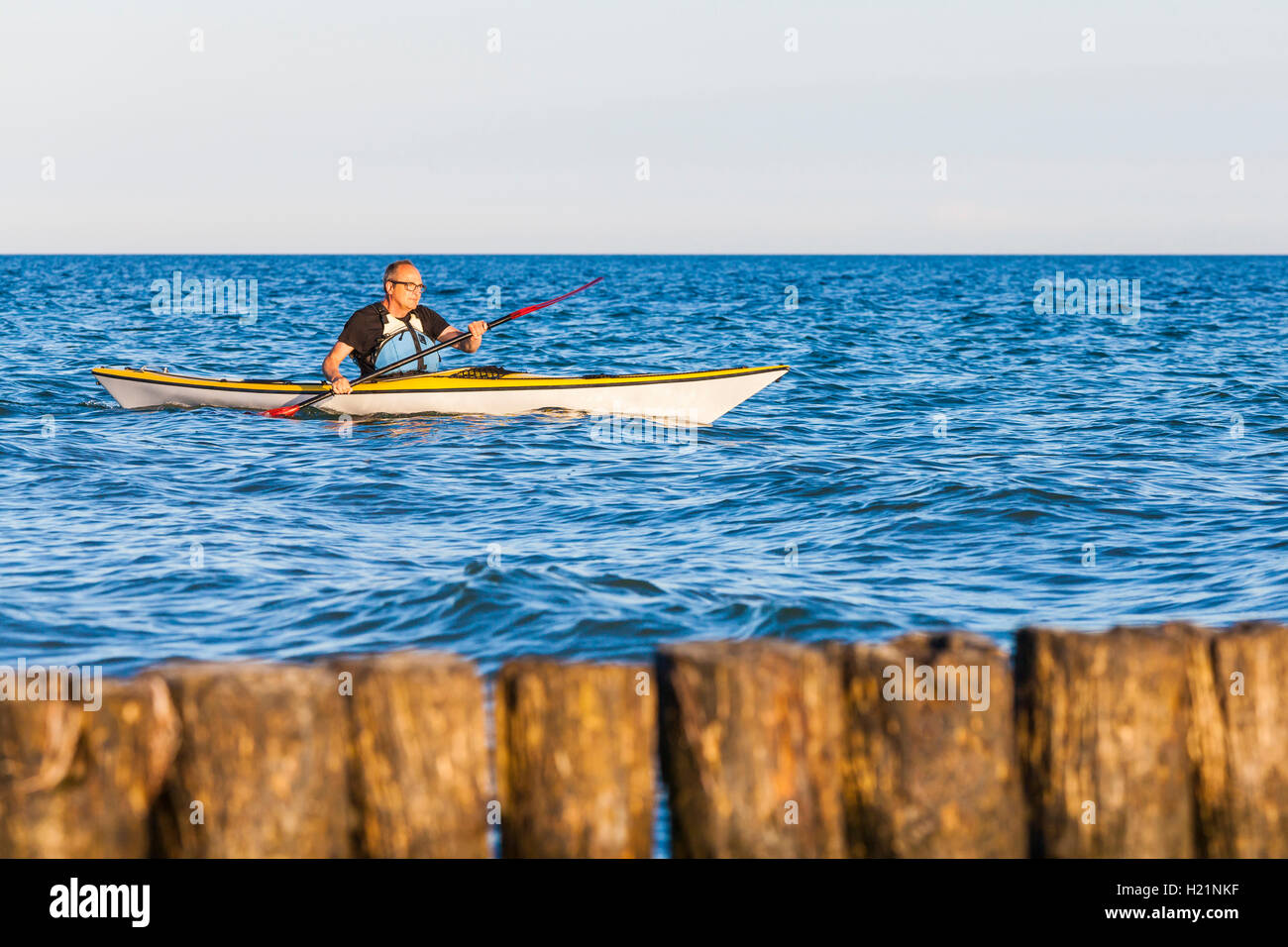 Denmark, senior man paddling, kayak Stock Photo