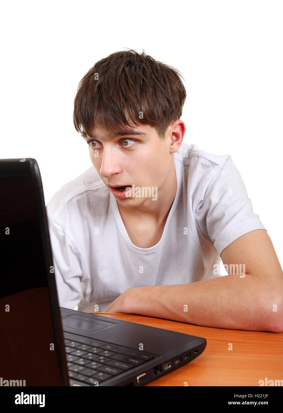 Surprised Teenager with Laptop Stock Photo - Alamy