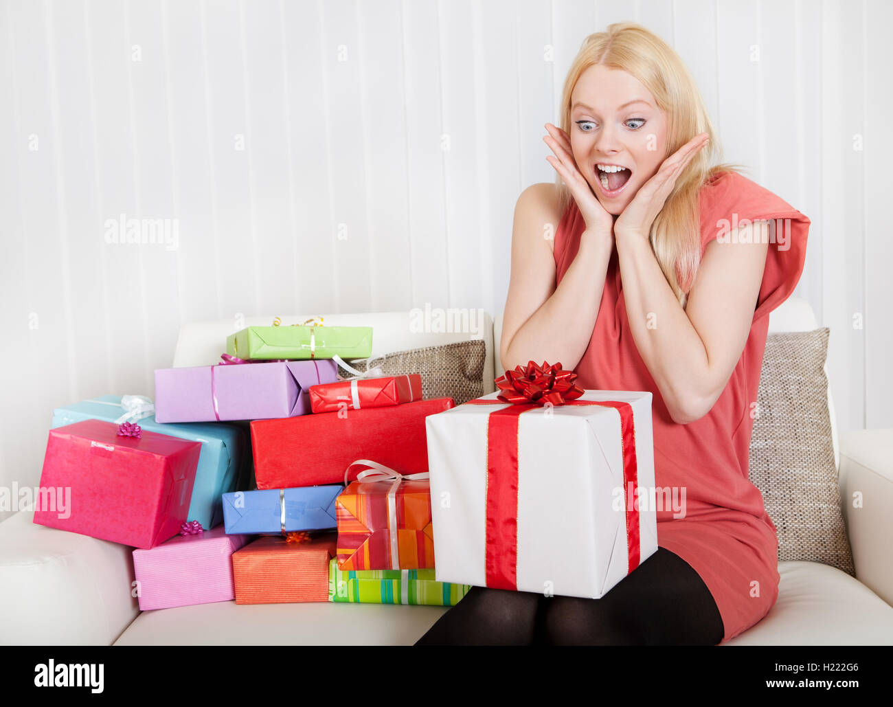 Beautiful young woman with her presents Stock Photo - Alamy