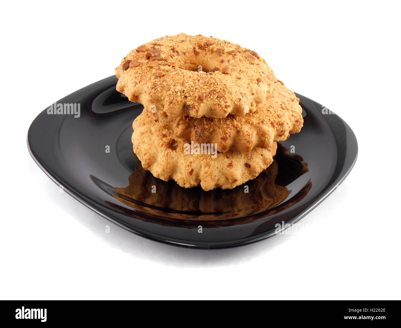 sweet tasty cake set on black plate Stock Photo - Alamy