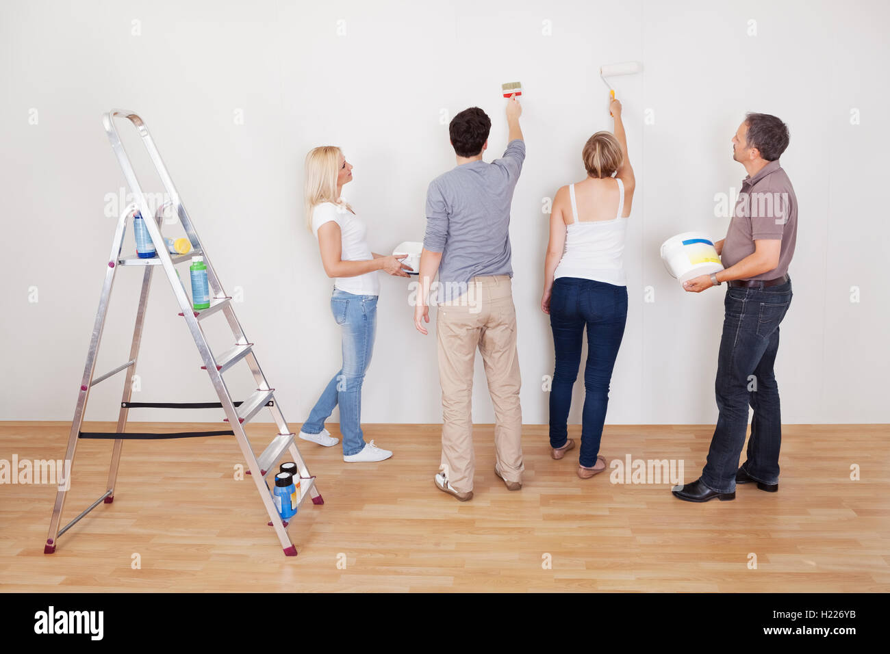 Family teamwork during home maintenance Stock Photo - Alamy