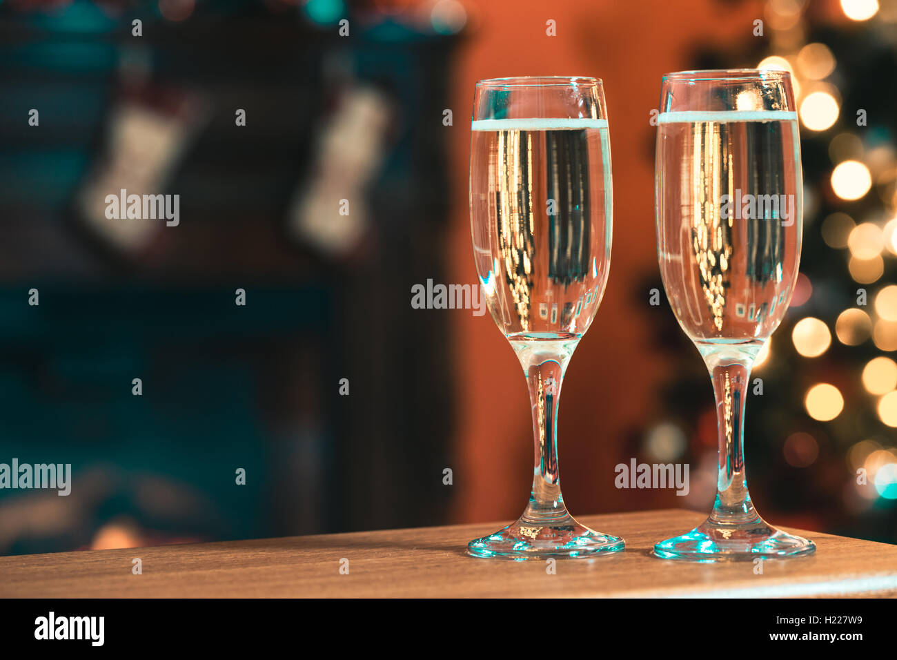 Two champagne glass on christmas bokeh background Stock Photo