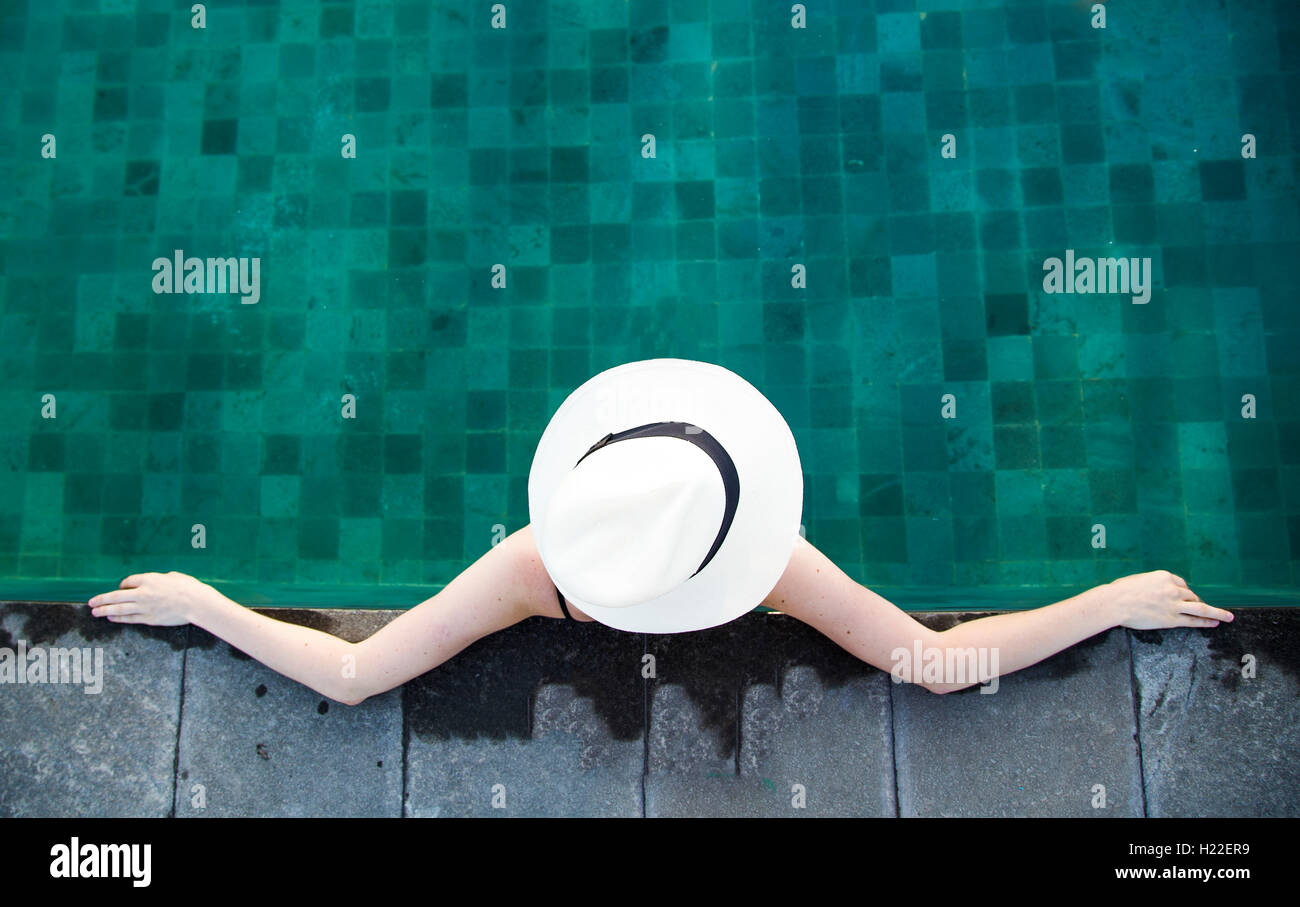 young woman in a swimming pool in Bali Stock Photo