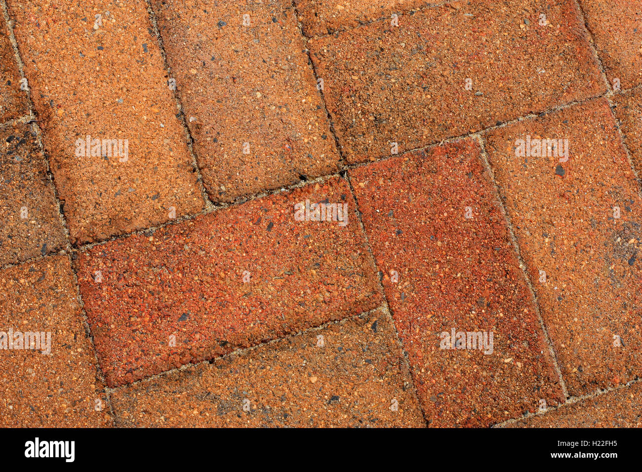 rough old orange bricks used as pavers Stock Photo Alamy
